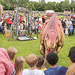 Baby T-Rex roaring at the crowd